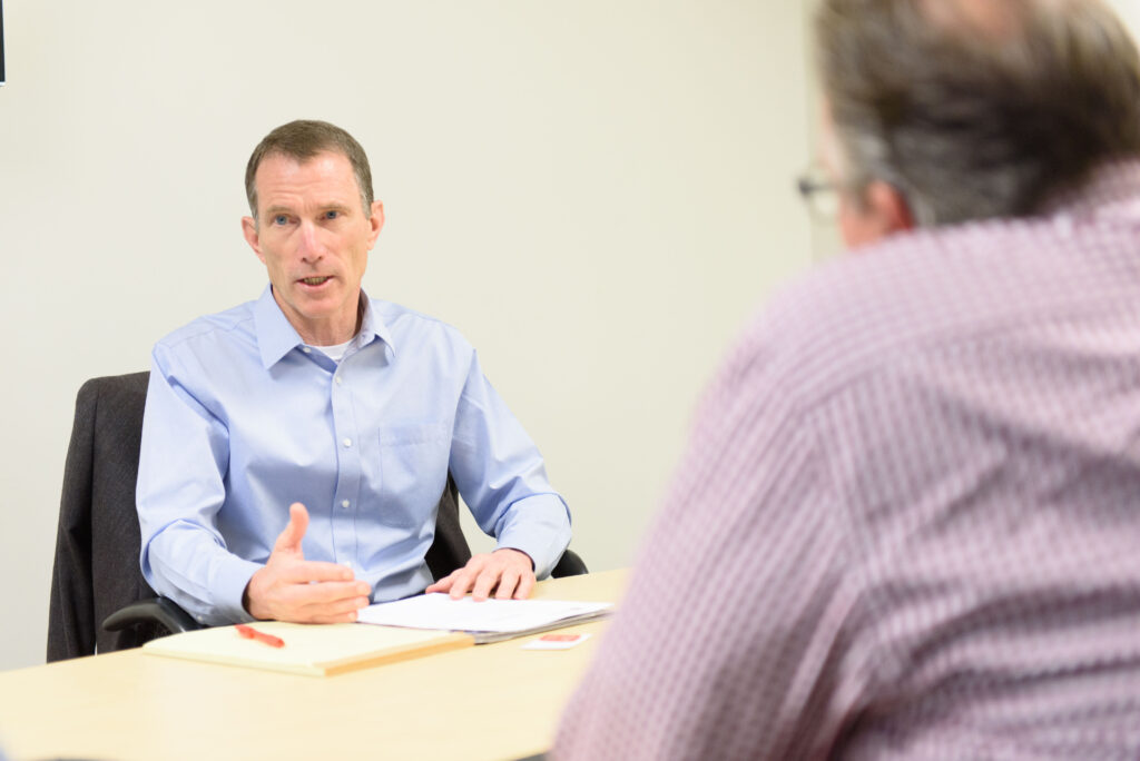 David Barnes, CEO, speaking animatedly in a meeting