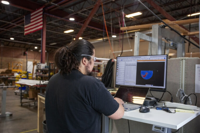 Isotec Employee examining weapons detection screening