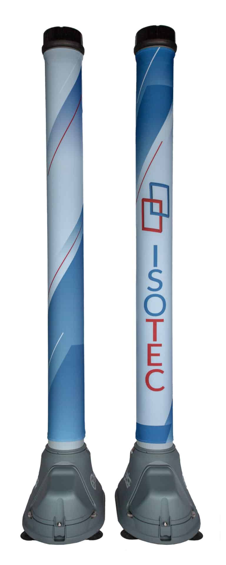 Two tall, freestanding OPENGATE columns with custom Isotec-branded graphic sleeves. Each column has a light blue design with curved accents, mounted on a dark gray base. The left column features the red and blue Isotec logo and name vertically printed.